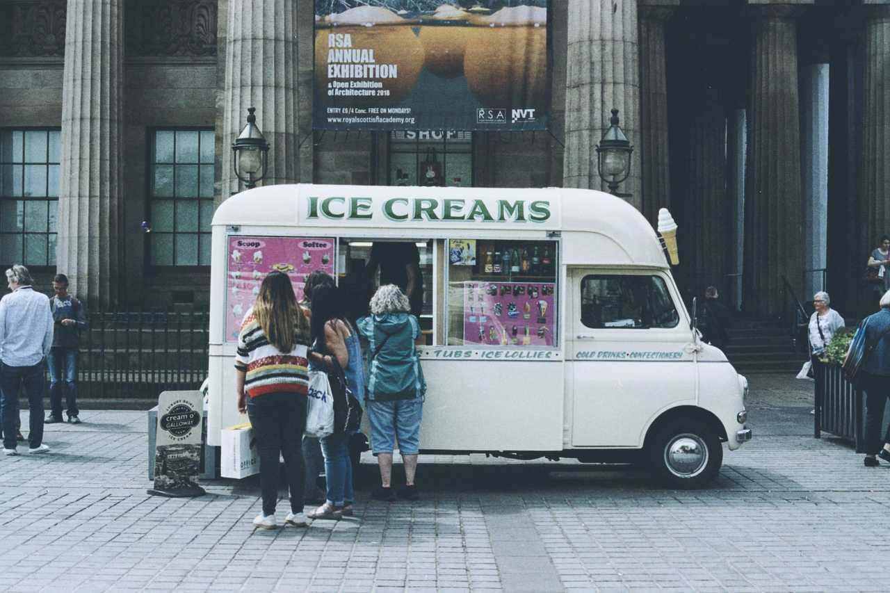 people queuing at an ice-cream truck