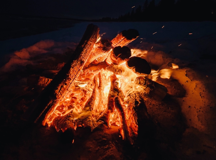 wood fire at night on beach
